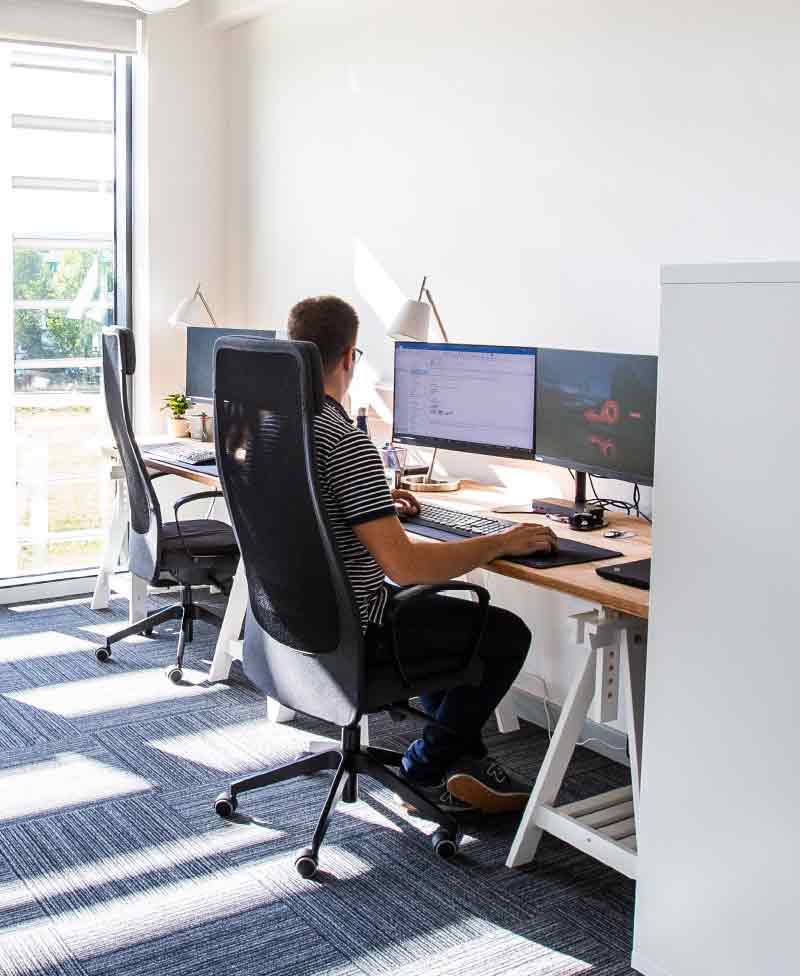 Man working on computer in workspace