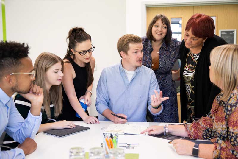 People collaborating around a desk