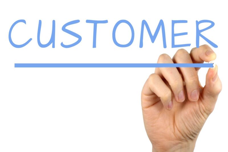 Hand writing the word customer