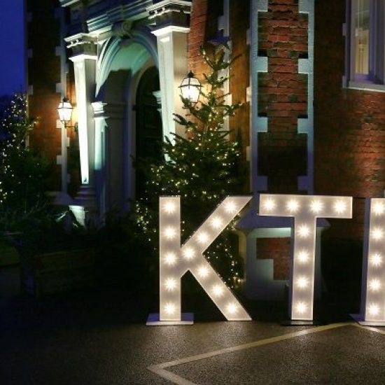 Knowledge Transfer Partnerships Initials Lit Outside at Night